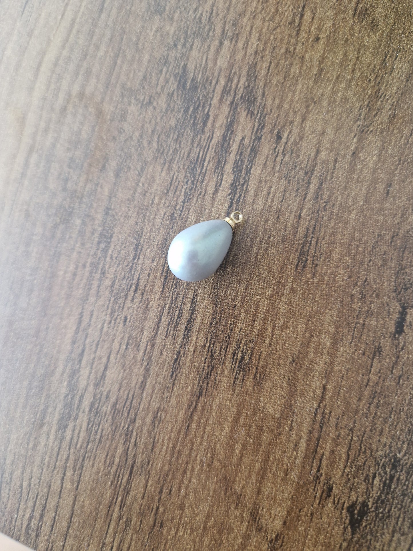 Pearly effect oval charm