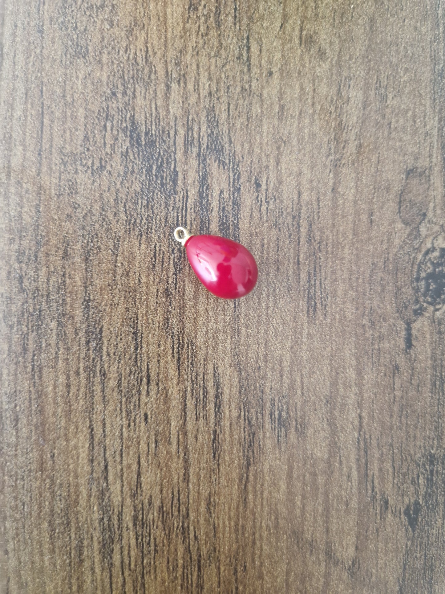 Pearly effect oval charm