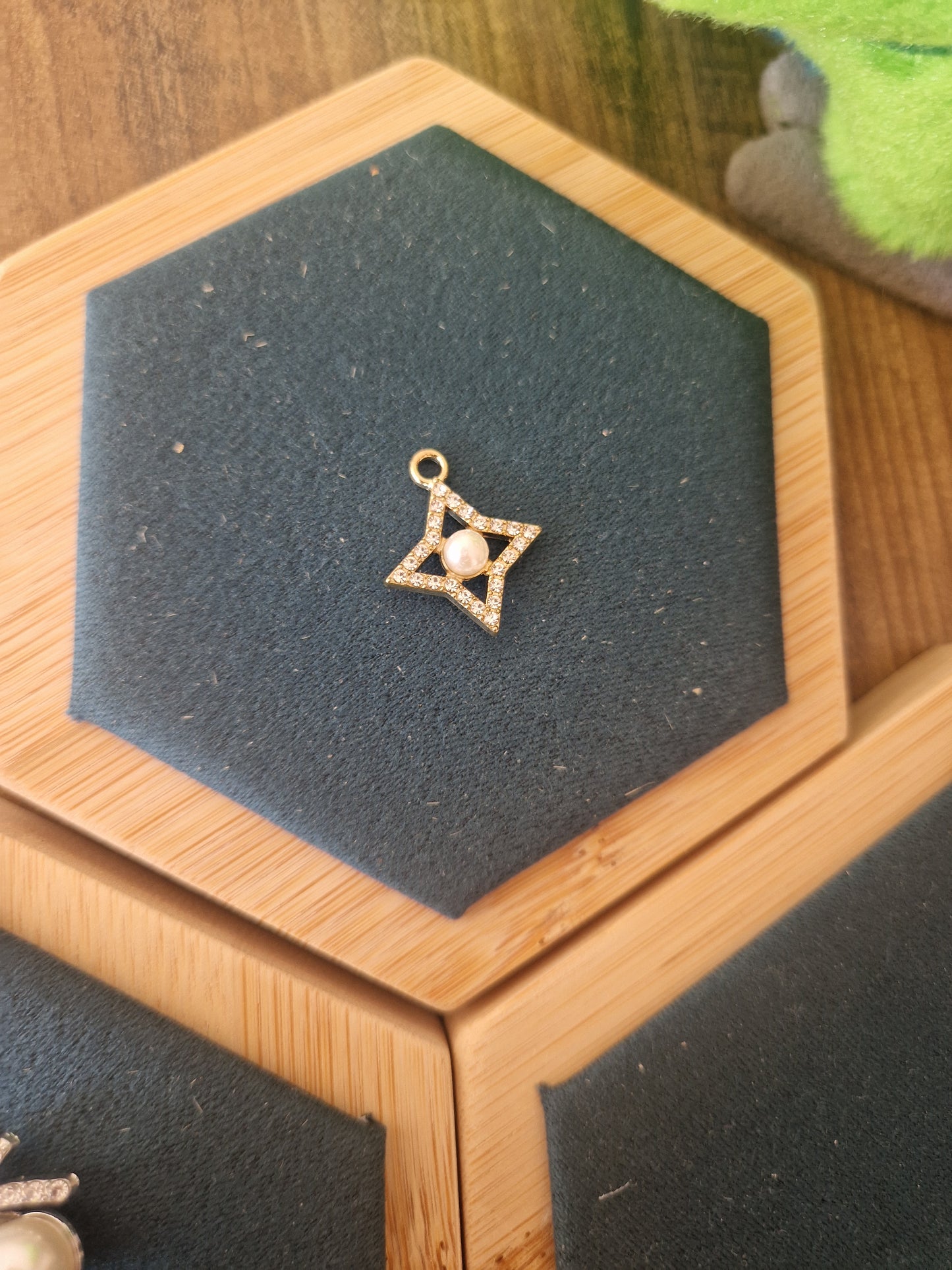 Gold 4-pointed rhinestone star charm