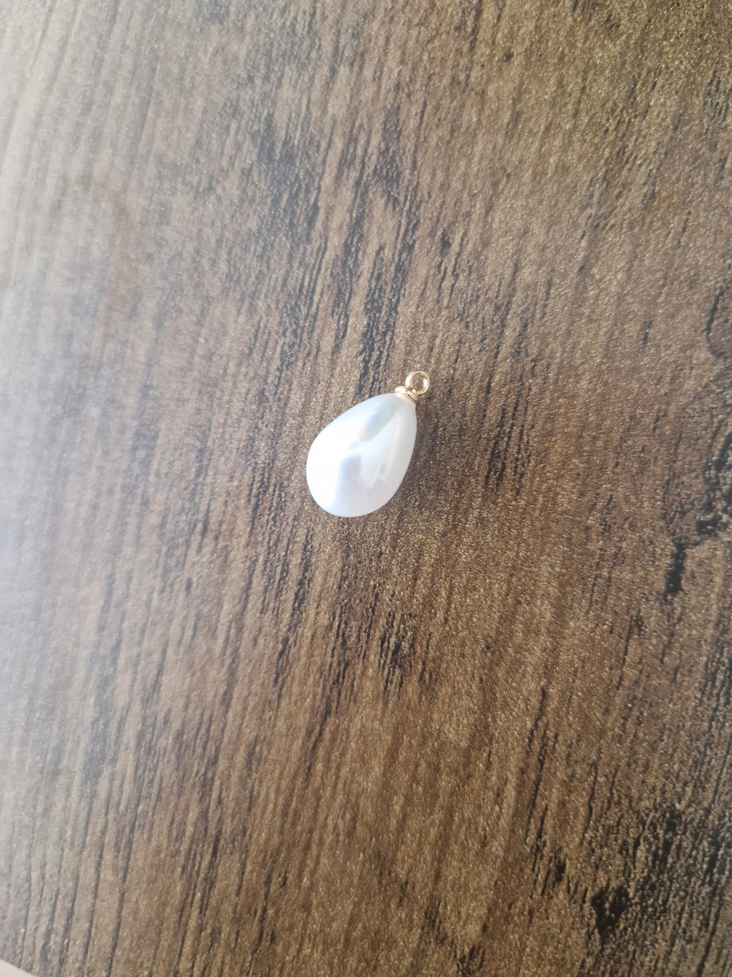 Pearly effect oval charm