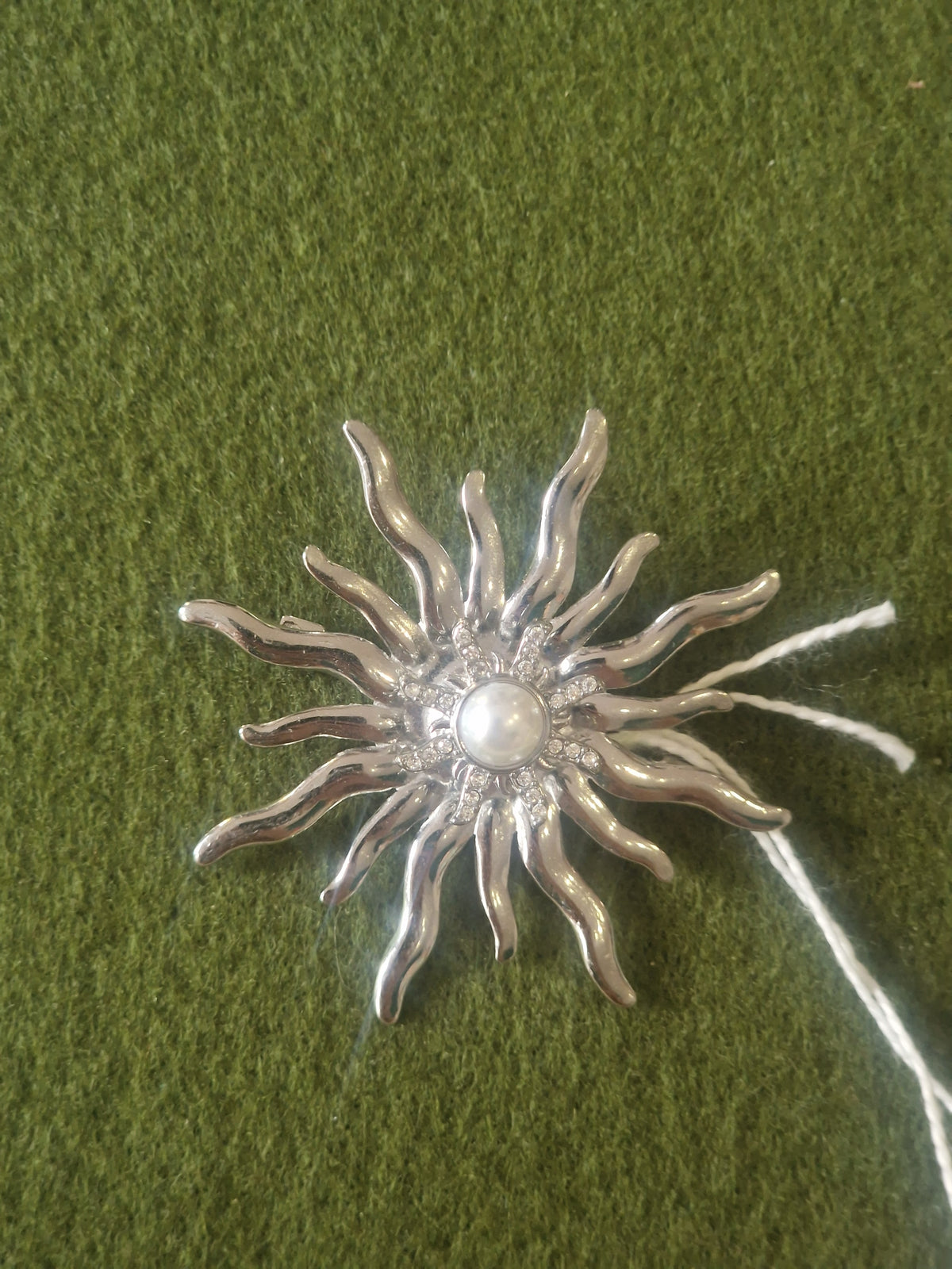 Broche soleil
